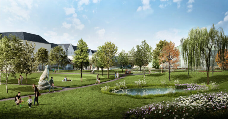 Beautifully landscaped gardens with a discreet and well proportioned hotel building in the background.
